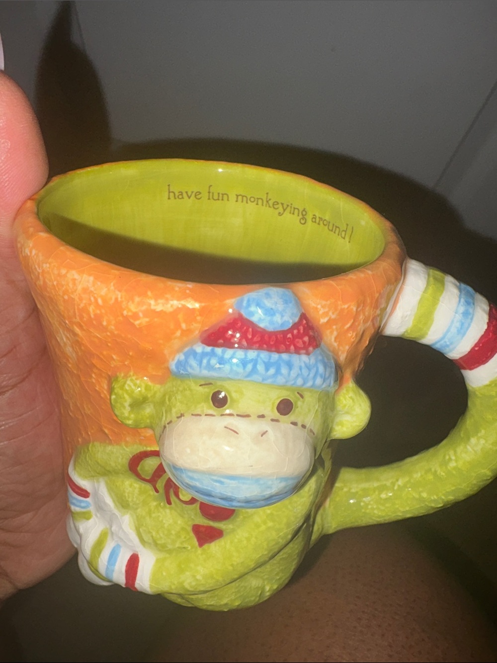 Whimsical Lime Green Monkey Ceramic Mug with Orange Rim